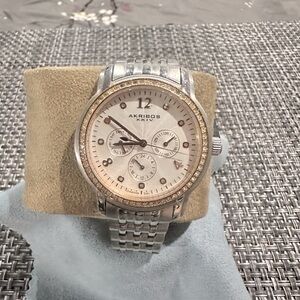 AKRIBOS XXIV Ladies oversized light pink face. Dial has pink zirconias around it